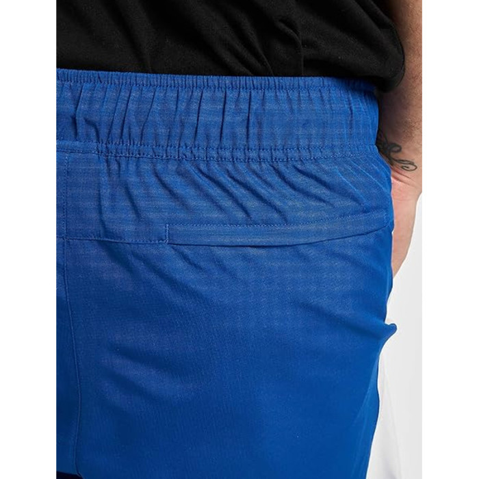 Pantalon de survêtement New Balance NB ATHLETICS WINDBREAKE
